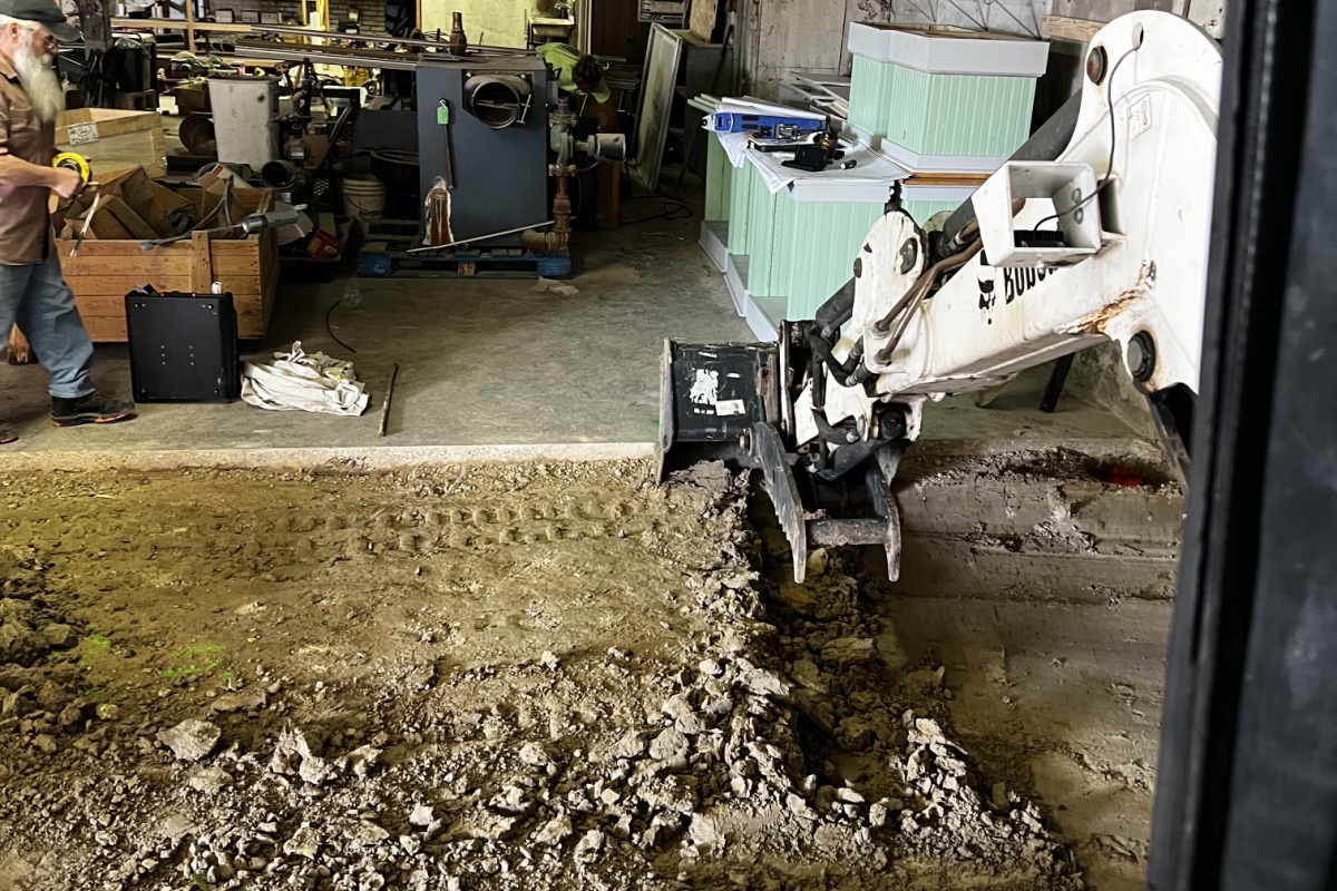Second Nature's commercial excavation contractors dig an elevator shaft for a historic building